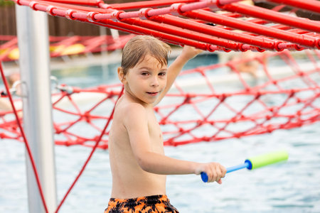 Cute child, boy in water park, having fun summertime together with brothersの写真素材