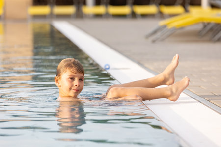 Cute child, boy in water park, having fun summertime together with brothersの写真素材