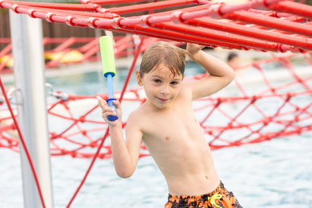Cute child, boy in water park, having fun summertime together with brothersの写真素材