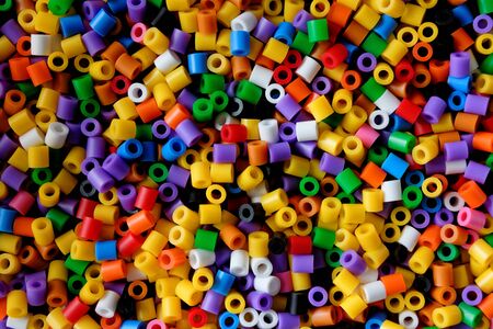 abstract background of close up multi colored beadsの写真素材