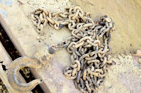 Chains mud stained yellow.old rusty chain.