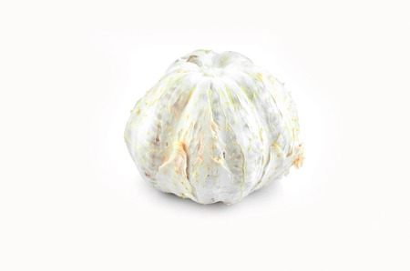 Fresh grapefruit peel green body in pink meat on a white background.の写真素材