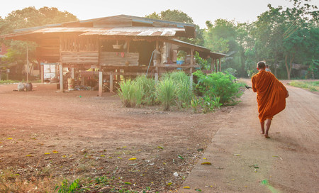 Buddha monk walk in the morning for receive food from Buddhism.の写真素材