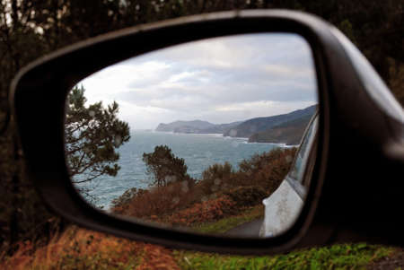 Bay of Biscay Spain Atlantic Ocean coast in car mirror