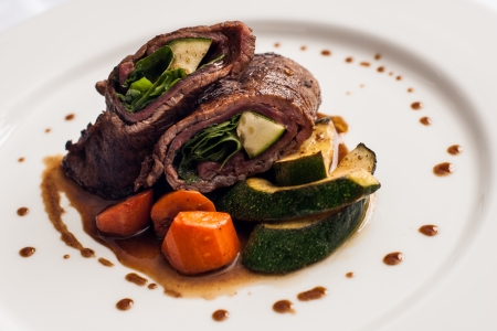Roast beef and gravy with vegetablesの写真素材