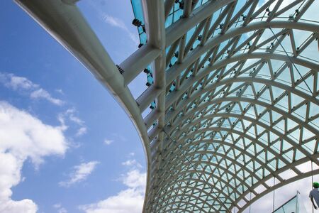 TBILISI, GEORGIA - August 14, 2018: Roof of the The Bridge of Peace is a pedestrian bridge over the Kura River (Mtkvari) in Tbilisi, Georgia.のeditorial素材
