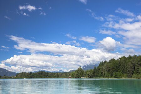 Cloudy sky over Faaker see in Ausrian Alps, Carinthia region