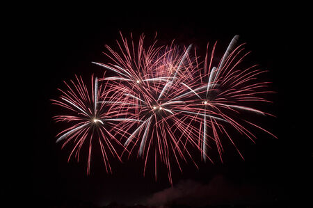 red fireworks in the night skyの写真素材