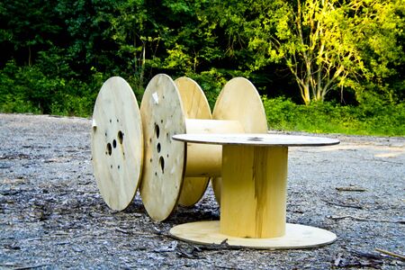 Three empty cable drums discarded in a Bavaria forest of Deutschlandの写真素材