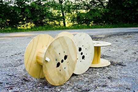 Old wooden cable bobbin discarded in a forest in bavaria, germanyの写真素材