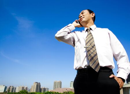 Chinese Businessman On Cell Phone の写真素材