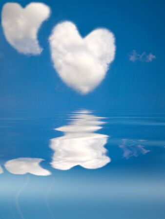 two love heart cloud in the clear sky and waterの写真素材