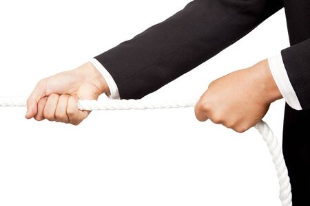 businessman's hands pulling a rope の写真素材