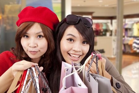 Two happy girls in a shopping center の写真素材