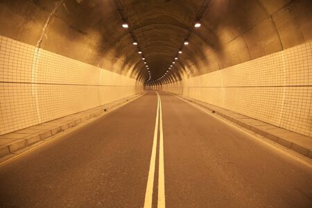 Road to the old tunel at night の写真素材