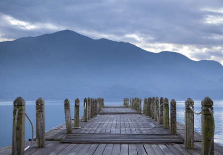 look on pier and mountain in the morningの写真素材