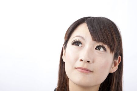 Close-up portrait of a beautiful asian woman and isolated on white background の写真素材