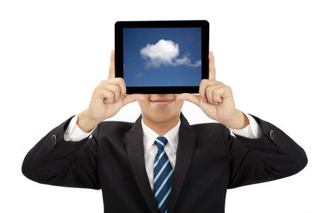 smiling businessman holding tablet pc and cloud thinking conceptの写真素材