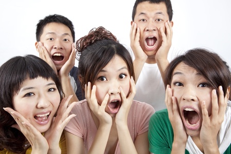 Closeup portrait of young group and surprised の写真素材