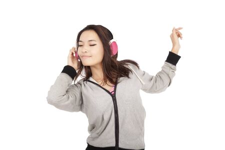 asian young woman listening to music and dancingの写真素材
