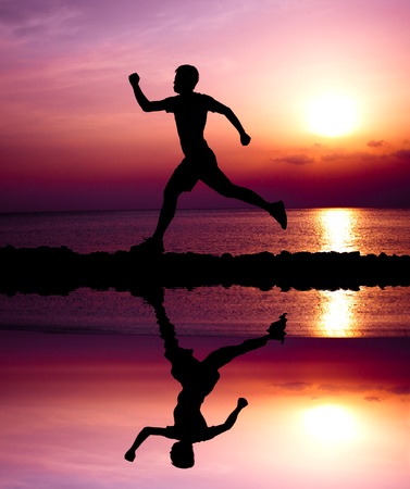 young runner with water reflectingの写真素材