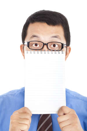 surprised businessman holding blank notebookの写真素材