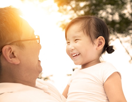 happy little girl with fatherの写真素材
