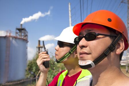 close up of  two asian refinery workers の写真素材