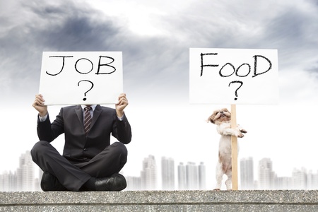 businessman looking for a job and dog looking for the foodの写真素材