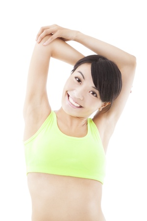 smiling Asian woman doing stretch exerciseの写真素材