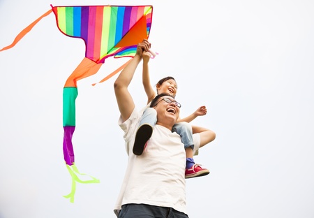 happy family with colorful kiteの写真素材