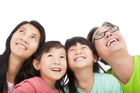 Happy family looking upの写真素材