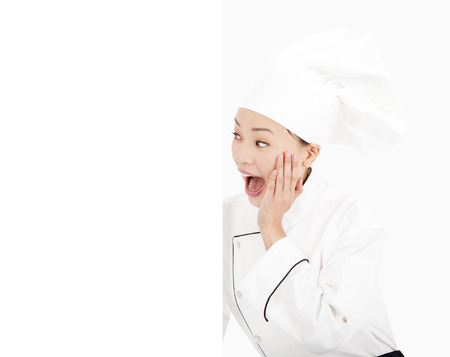 unbelievable asian woman chef looking boardの写真素材