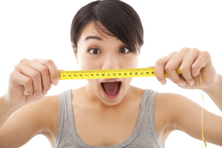 unbelievable woman looking at the mesurement result の写真素材