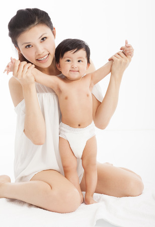 Happy  mother holding  healthy child baby boyの写真素材