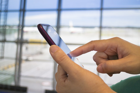 business people using smart phone with office  backgroundの写真素材