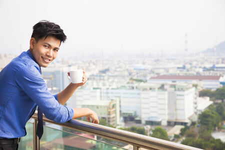 relaxed businessman watching the city viewの写真素材