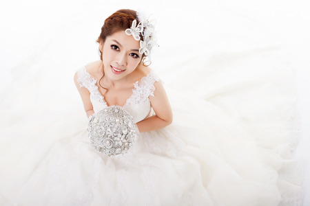 Young attractive bride with flowersの写真素材