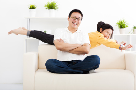happy family in living roomの写真素材