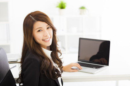 happy young business woman working in the officeの写真素材