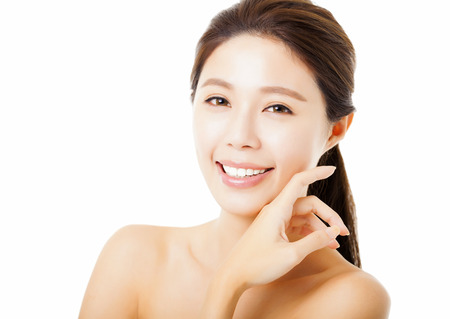 closeup beautiful young  woman face isolated on whiteの写真素材