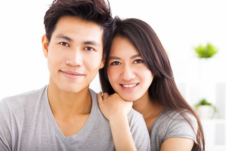 Young happy couple hugging and smilingの写真素材