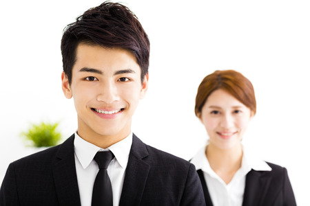 happy business man and woman standing  in officeの写真素材