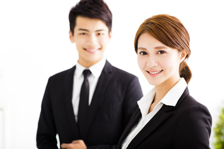happy business man and woman standing  in officeの写真素材