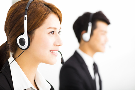 young business people working with headset in officeの写真素材