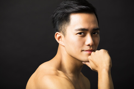 Closeup portrait of attractive young man faceの写真素材