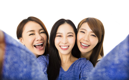 young woman group having fun together and taking selfie