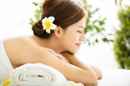 Beautiful young woman enjoy spa salonの写真素材