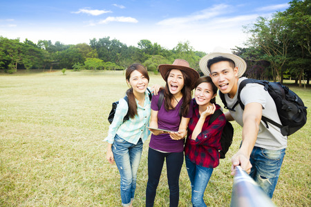Top view of  happy young group making selfie by  smart phoneの写真素材