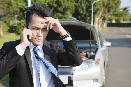stress business man calling for help with  car broken concept